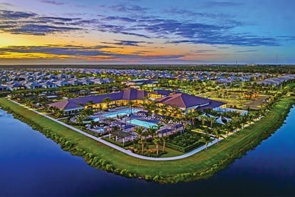 Aerial view of a luxury clubhouse at GL Homes' Valencia Grand 55+ community in Boynton Beach featuring resort-style amenities.